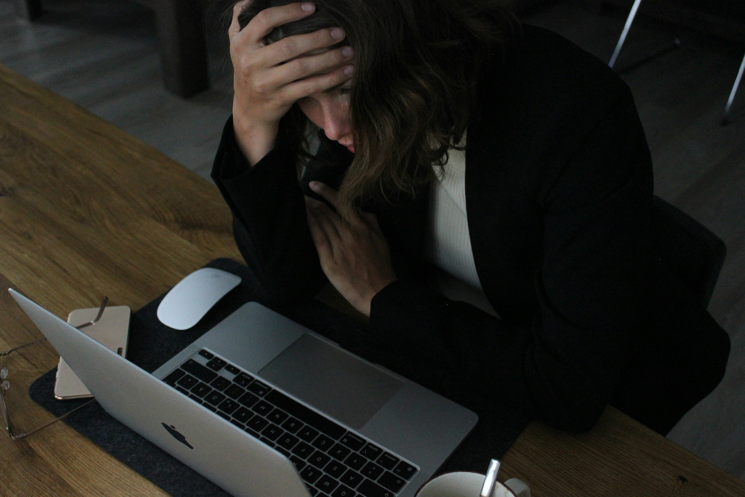a business woman who is frustrated because she is working too much