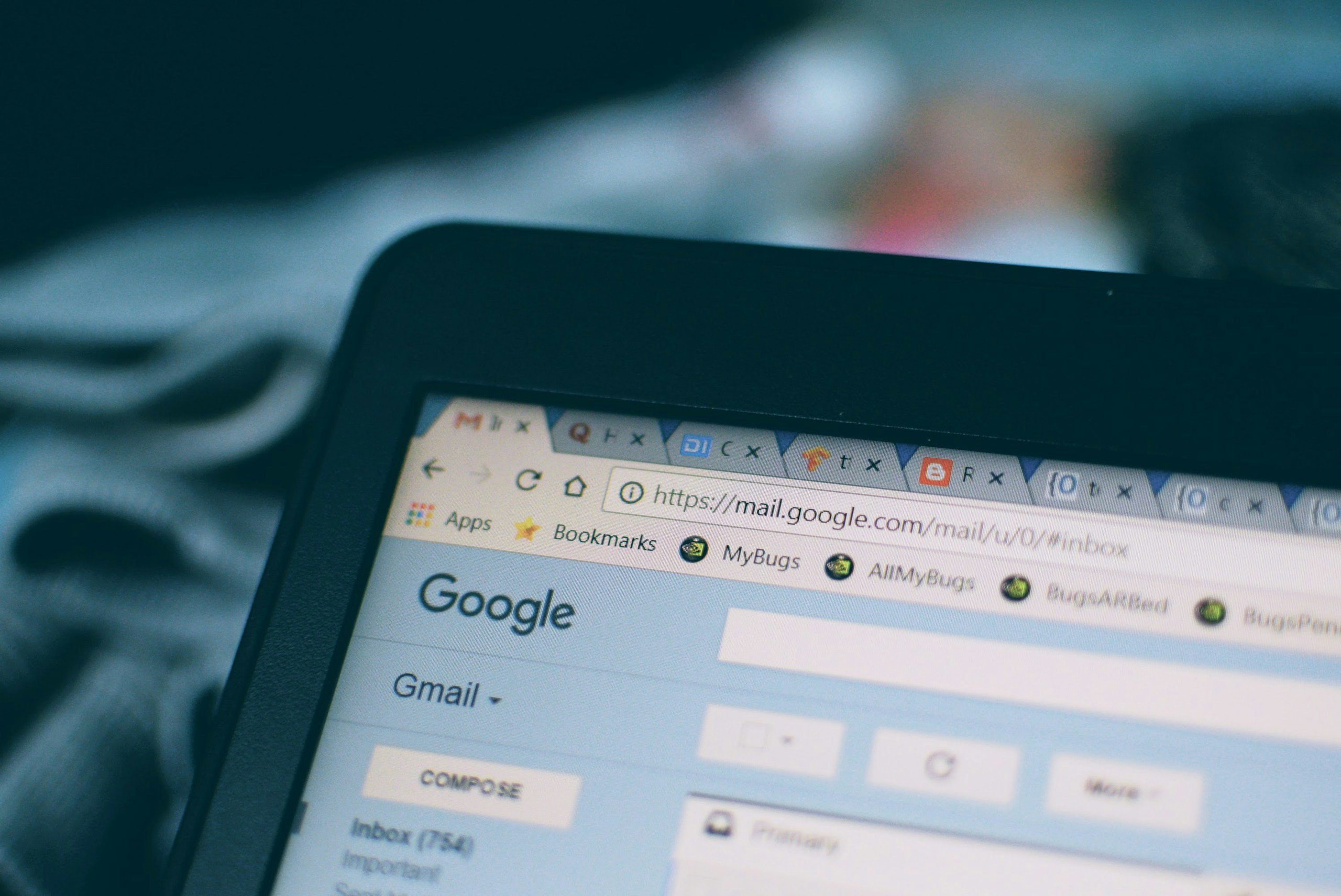 Close up of a tablet screen with multiple browser tabs open.