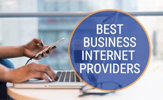 People working on phone and laptop (caption: Best Business Internet Providers)