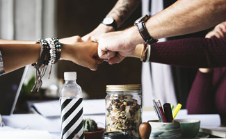 Team fists coming together