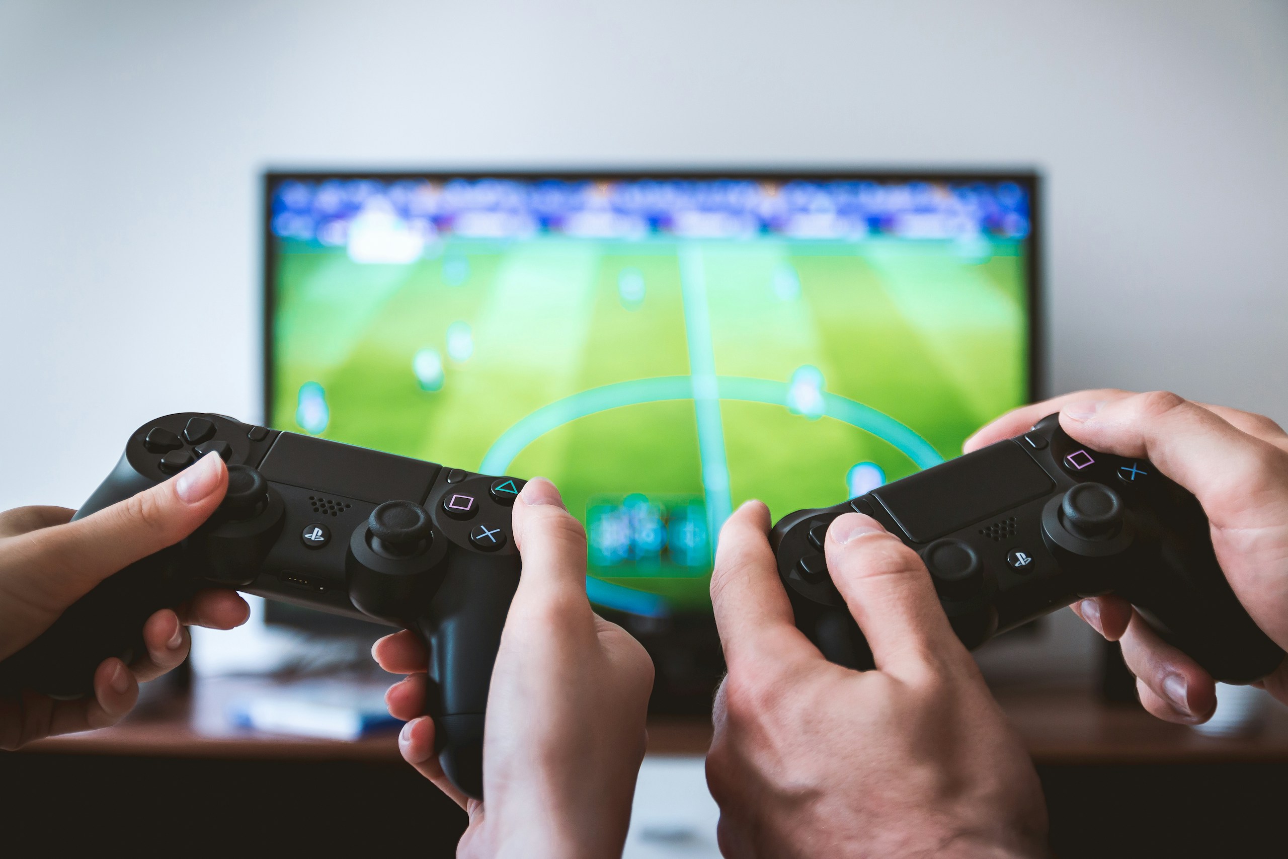 Hands holding the game controllers