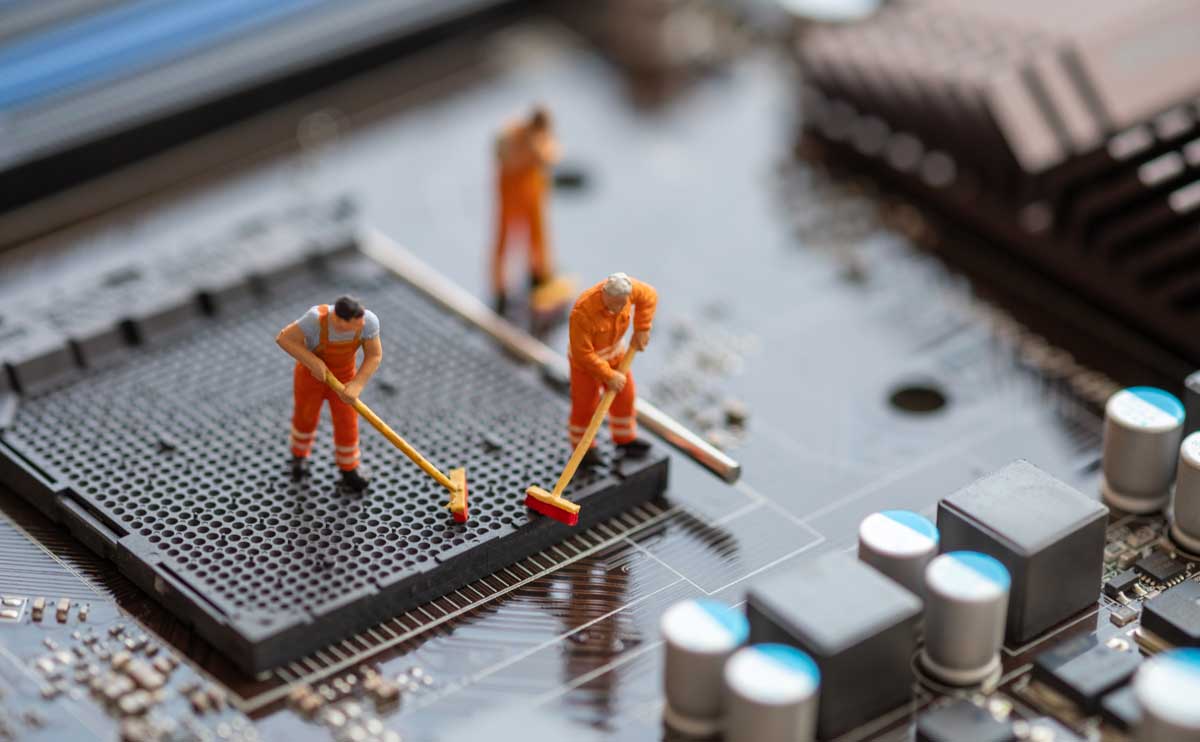miniature figures cleaning motherboard