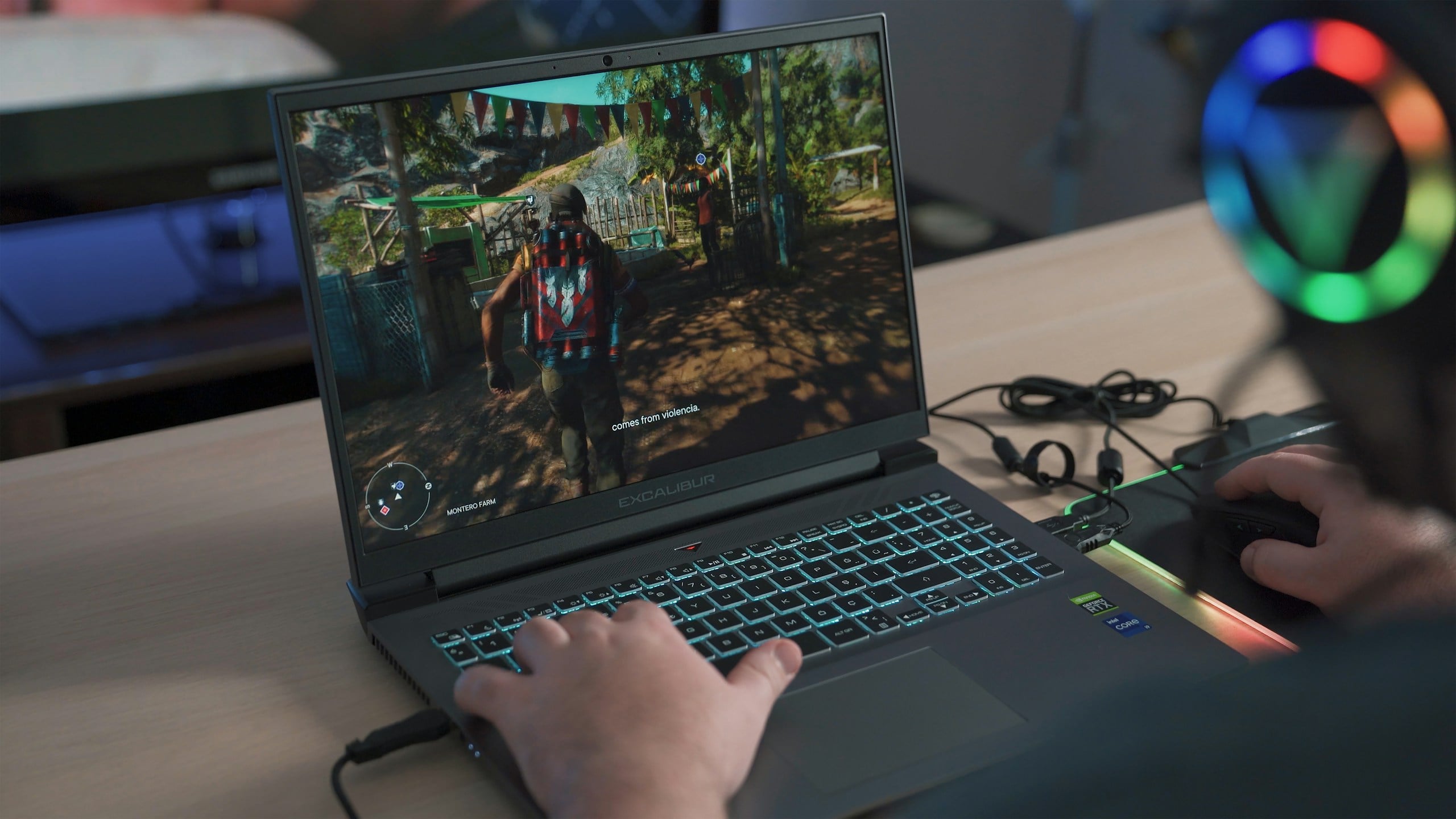 Playing Far Cry 6 game on laptop.